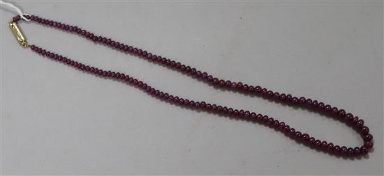 A ruby bead necklace, 22.5cm drop